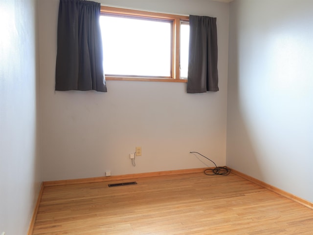 unfurnished room featuring light hardwood / wood-style flooring