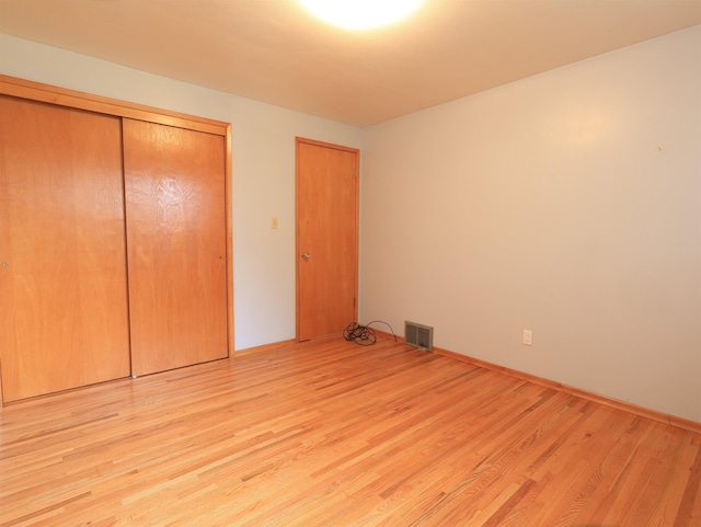 unfurnished bedroom featuring light wood-type flooring