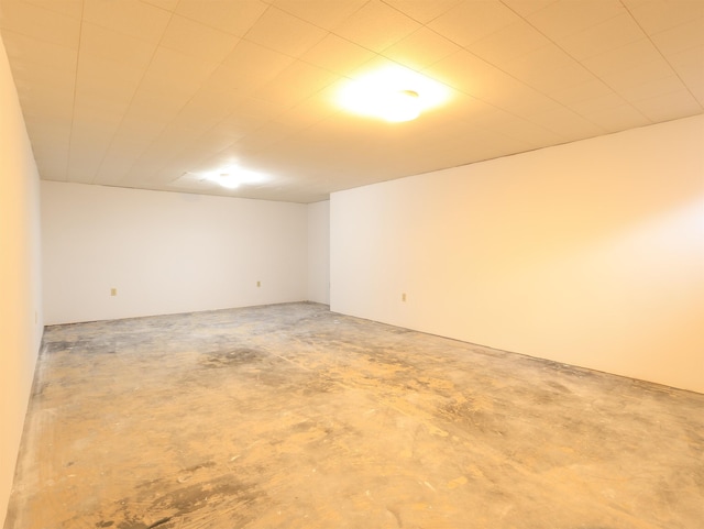 unfurnished room featuring concrete floors