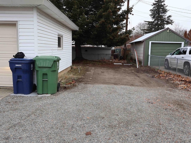 view of side of property featuring a garage and an outdoor structure