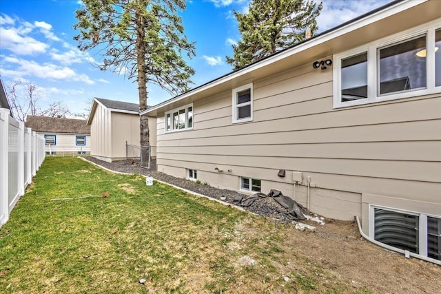 view of home's exterior featuring a yard