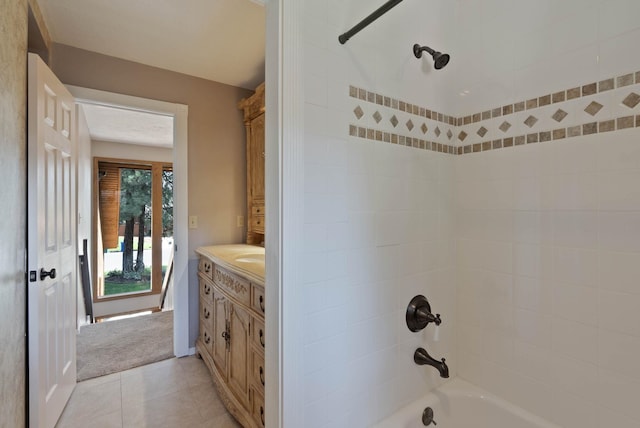 bathroom with shower / bathing tub combination, tile patterned flooring, and vanity