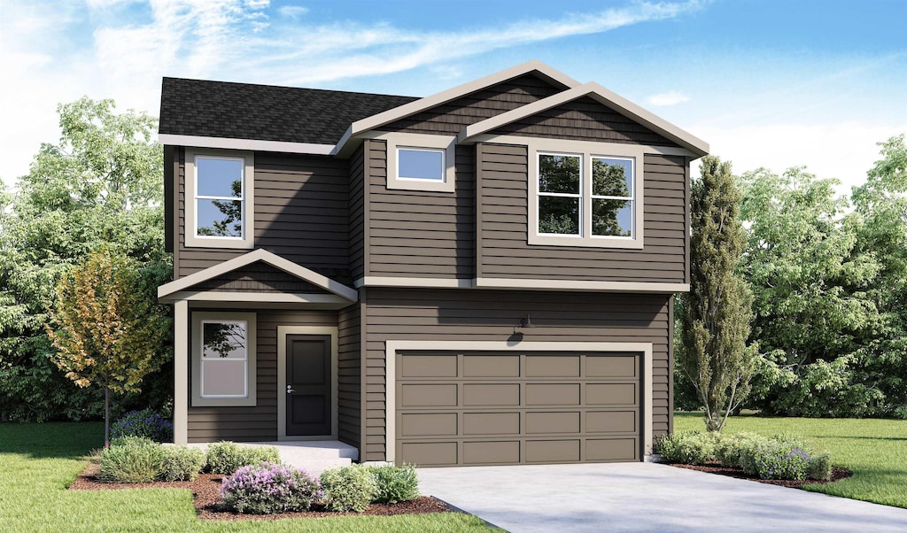 view of front of property with a front yard and a garage