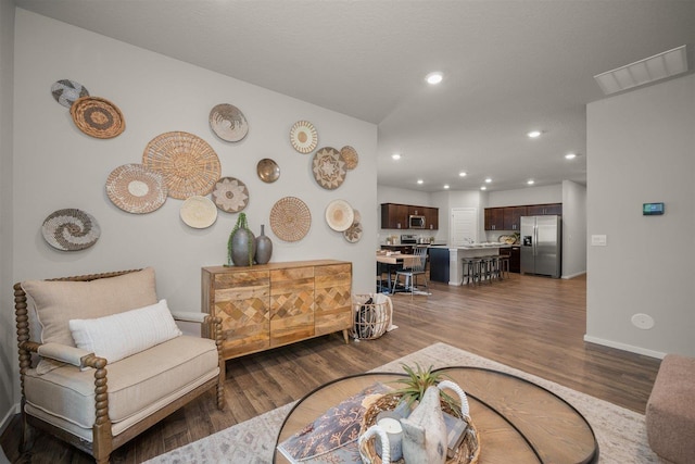 living room with dark hardwood / wood-style floors