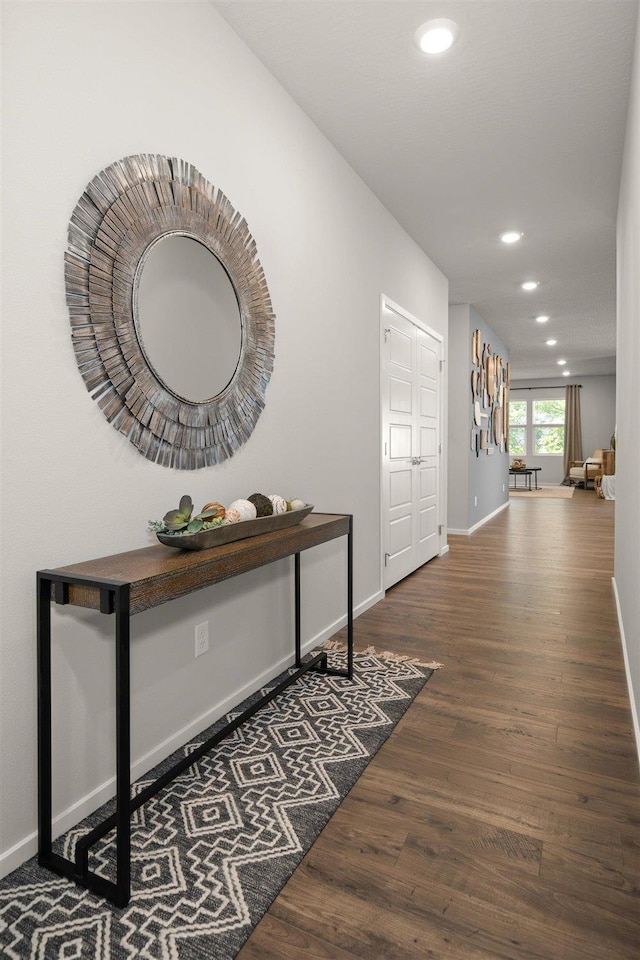 hall with dark hardwood / wood-style flooring