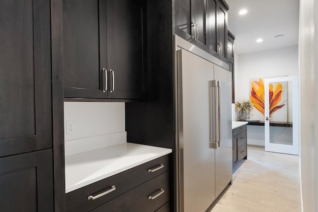 kitchen featuring high quality fridge and light wood-type flooring