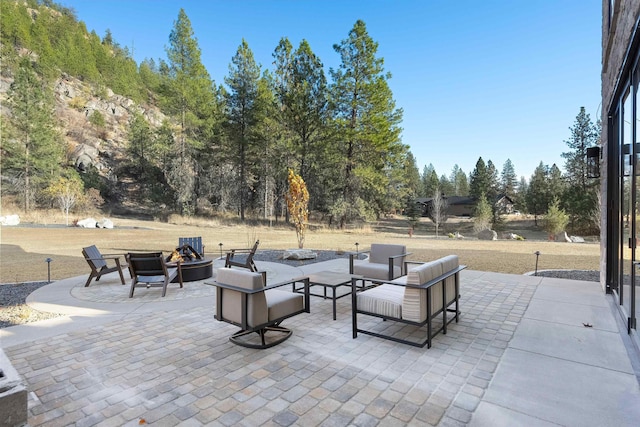 view of patio with a fire pit