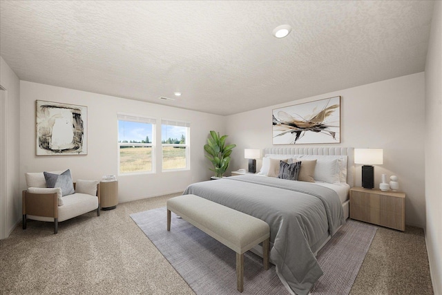 bedroom featuring a textured ceiling and light colored carpet