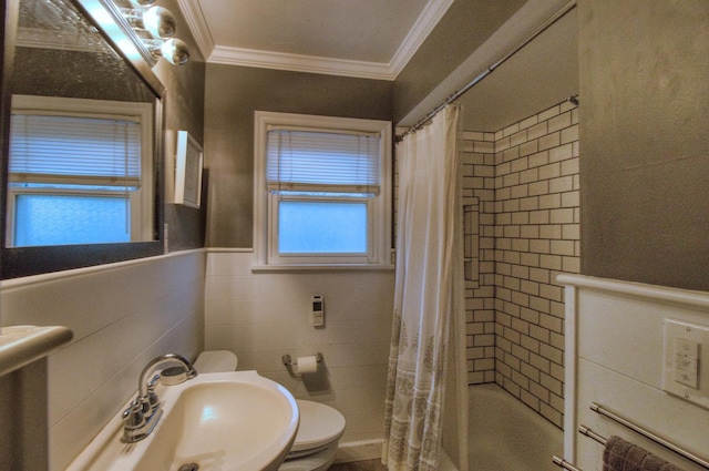 full bathroom featuring toilet, sink, shower / tub combo, tile walls, and ornamental molding