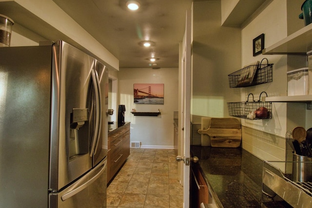 kitchen featuring stainless steel fridge