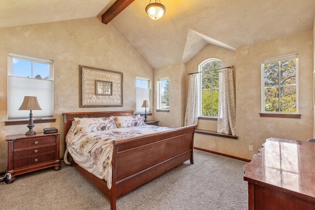 bedroom featuring lofted ceiling with beams and light carpet