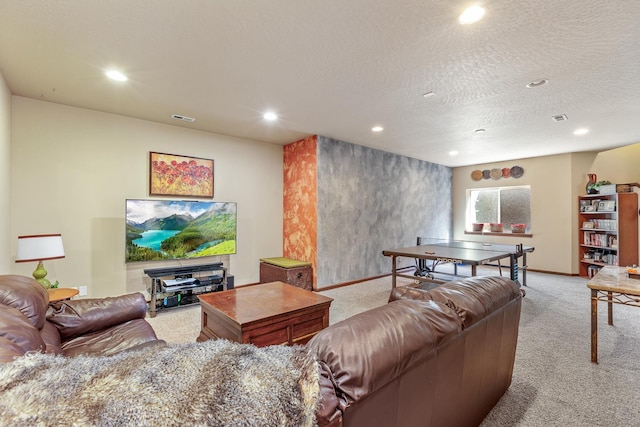 carpeted living room featuring a textured ceiling