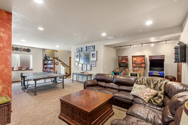 living room with light colored carpet and rail lighting