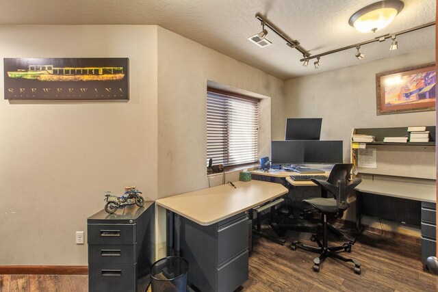 office area featuring track lighting, a textured ceiling, and dark wood-type flooring