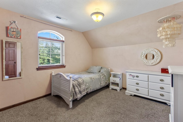 bedroom featuring lofted ceiling and carpet flooring