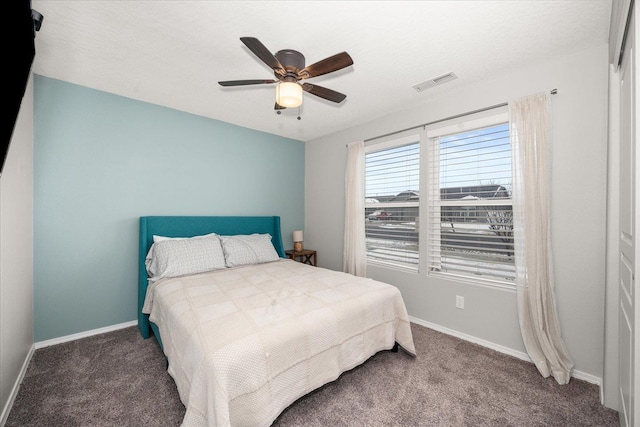 bedroom with ceiling fan and carpet flooring