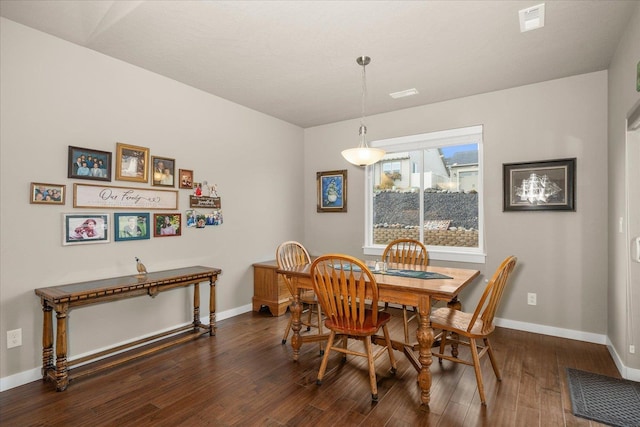 dining room with dark wood-type flooring