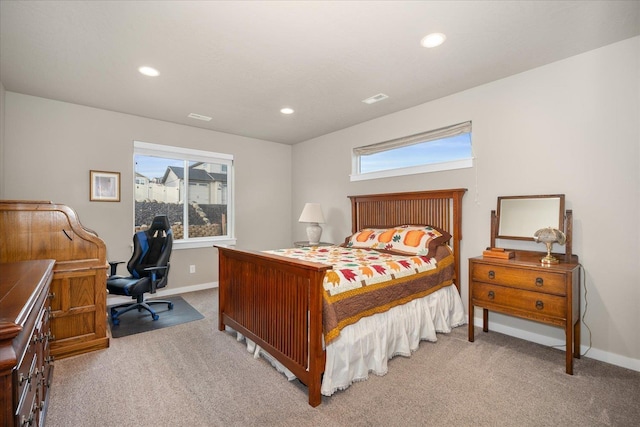 bedroom featuring light carpet