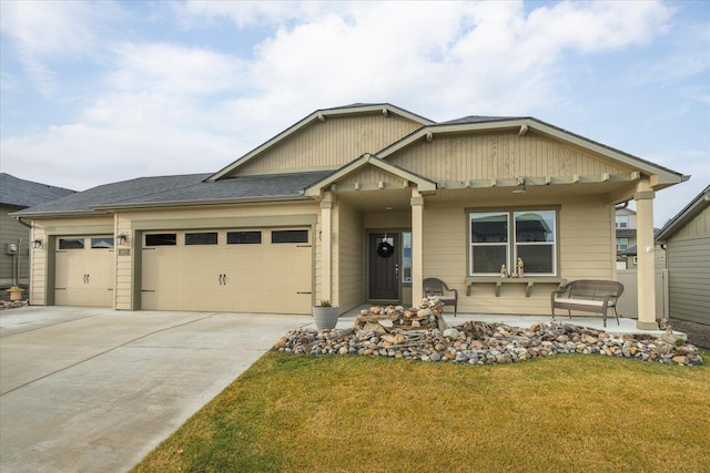 view of front of house featuring a front lawn and a garage