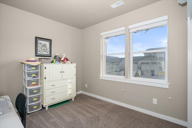 unfurnished bedroom featuring dark colored carpet