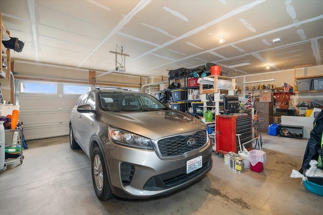 garage with a workshop area