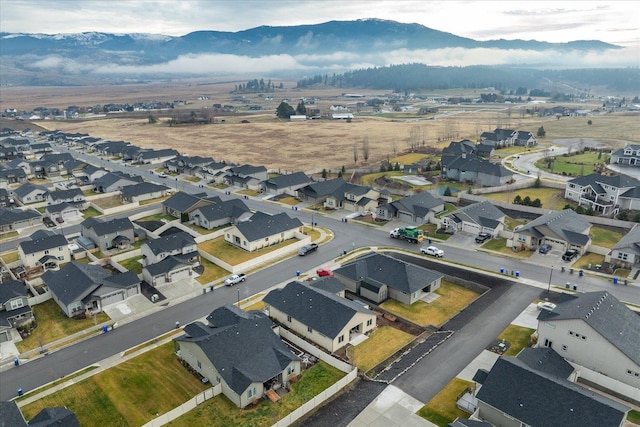 birds eye view of property with a mountain view