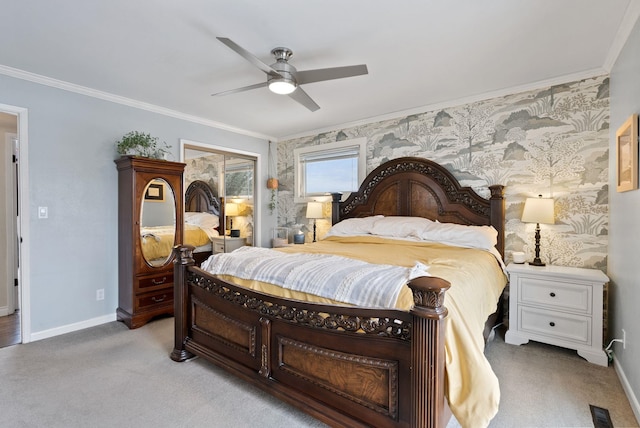 bedroom with ornamental molding, light colored carpet, and ceiling fan