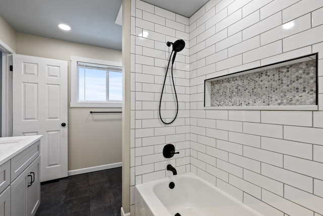 bathroom with vanity and tiled shower / bath