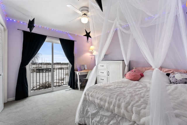 carpeted bedroom featuring ceiling fan, access to outside, and a closet