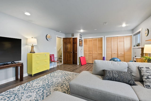 living room with dark hardwood / wood-style floors