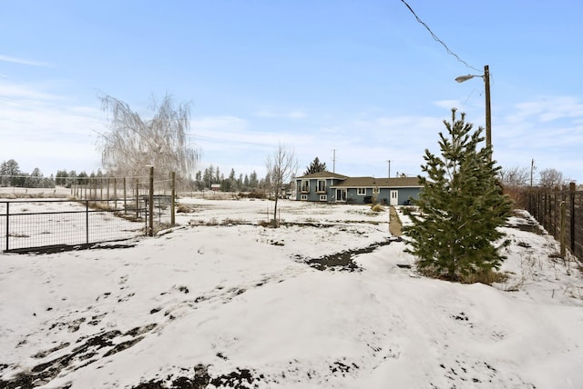 view of yard layered in snow