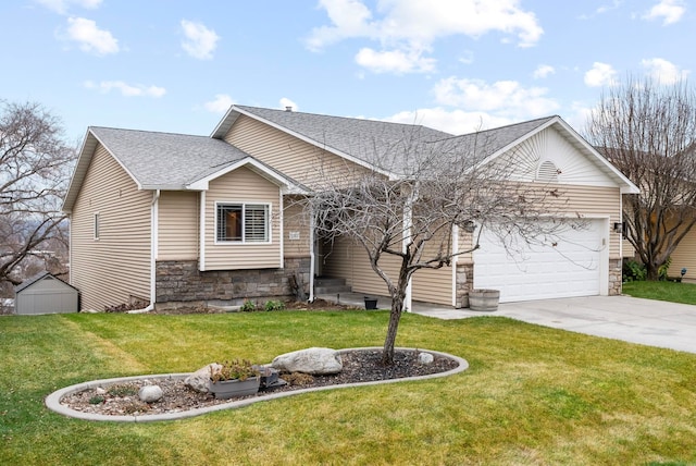 view of front of property featuring a garage and a front lawn