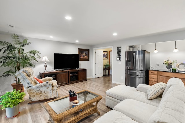 living room with light hardwood / wood-style floors