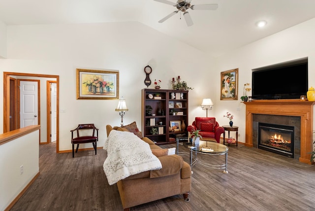 living room featuring lofted ceiling, ceiling fan, and dark hardwood / wood-style floors