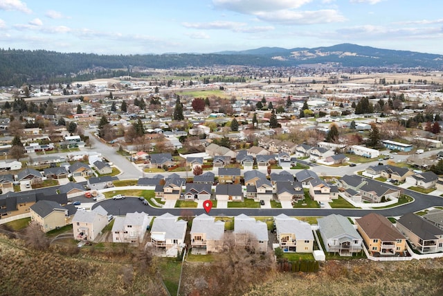 birds eye view of property featuring a mountain view