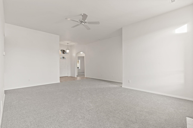 unfurnished room featuring carpet floors and ceiling fan