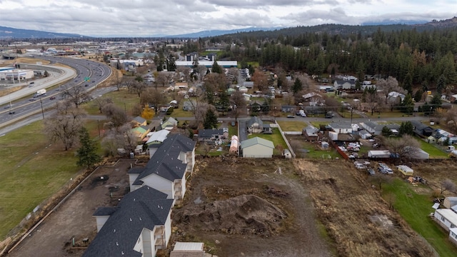 birds eye view of property with a mountain view