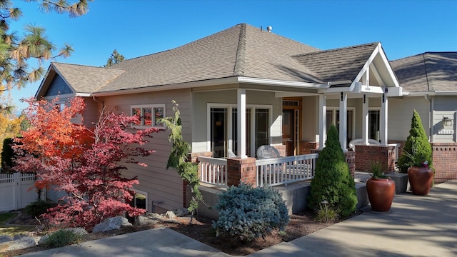 back of property with covered porch