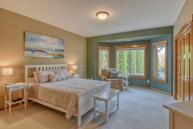 carpeted bedroom with ensuite bathroom