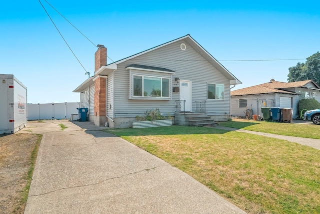 bungalow-style house featuring a front yard