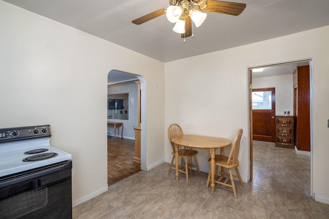 dining area with ceiling fan and light parquet floors