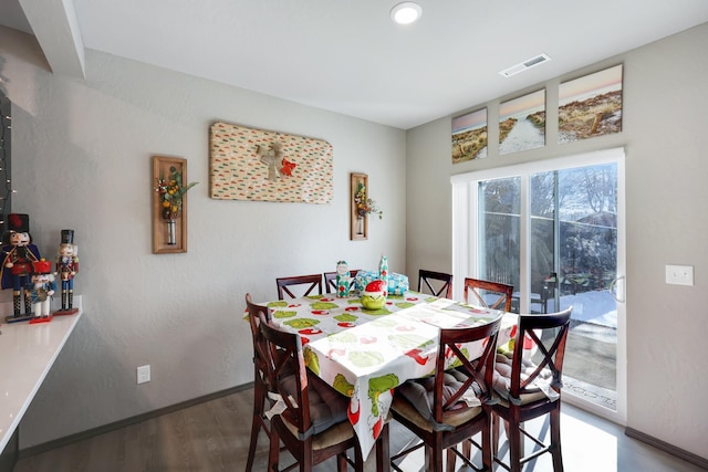 dining area featuring wood-type flooring