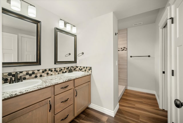 bathroom featuring wood-type flooring and vanity