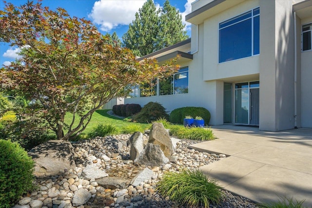 view of home's exterior featuring a patio area