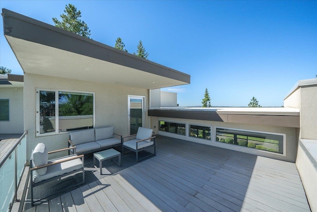 wooden deck with an outdoor living space