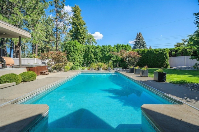 view of swimming pool with a hot tub, a grill, and a patio