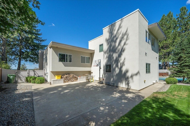 back of house featuring a patio