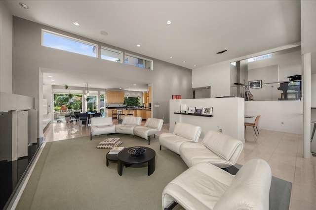 tiled living room with a towering ceiling