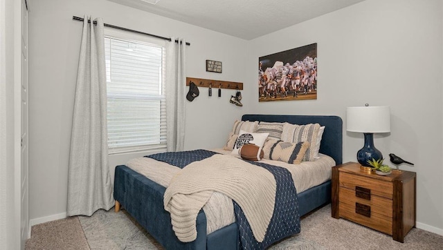 bedroom with light carpet