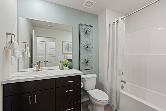 3122 N Glenrose Rd, Spokane, WA 99217 - bathroom featuring vanity, shower / bath combo with shower curtain, and wood finished floors